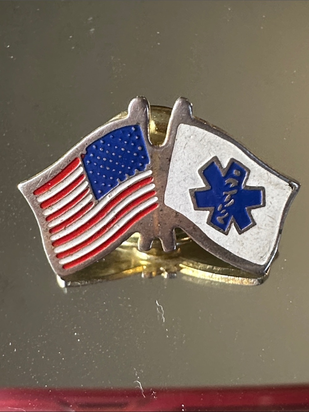 Gold-Toned EMS/EMT Lapel Pin featuring crossed American and Star of Life flags